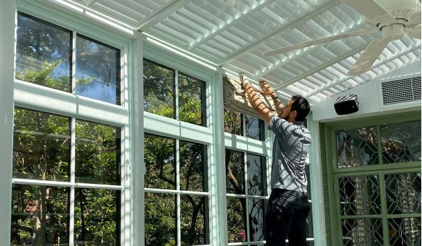 Man installing shades