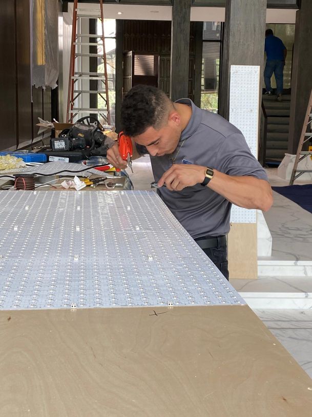 Man working on LED installation