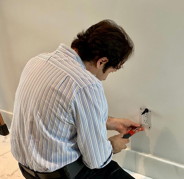 Man installing a power socket